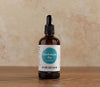 Bottle of Viridian Electrolyte Fix on a wooden surface with a beige background
