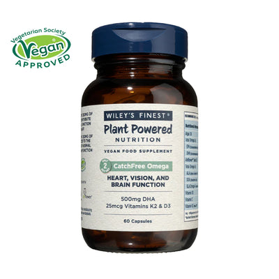 Vitamin supplement bottle with label on a white background, featuring the Vegetarian Society Vegan Approved logo.