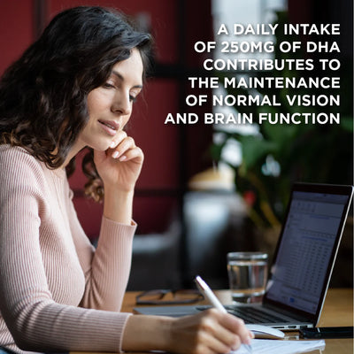 Woman sitting at a desk with a laptop, pen, and glass of water, with text about DHA intake.