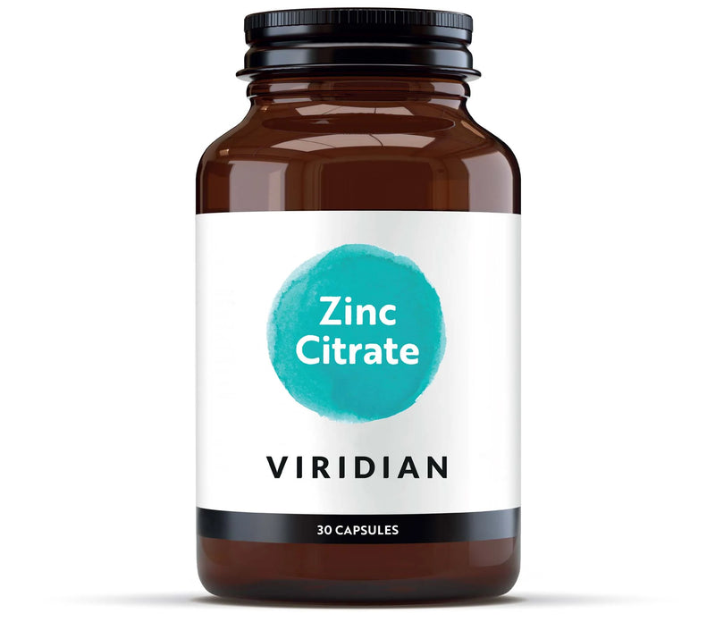 Bottle of viridian zinc citrate capsules on a white background